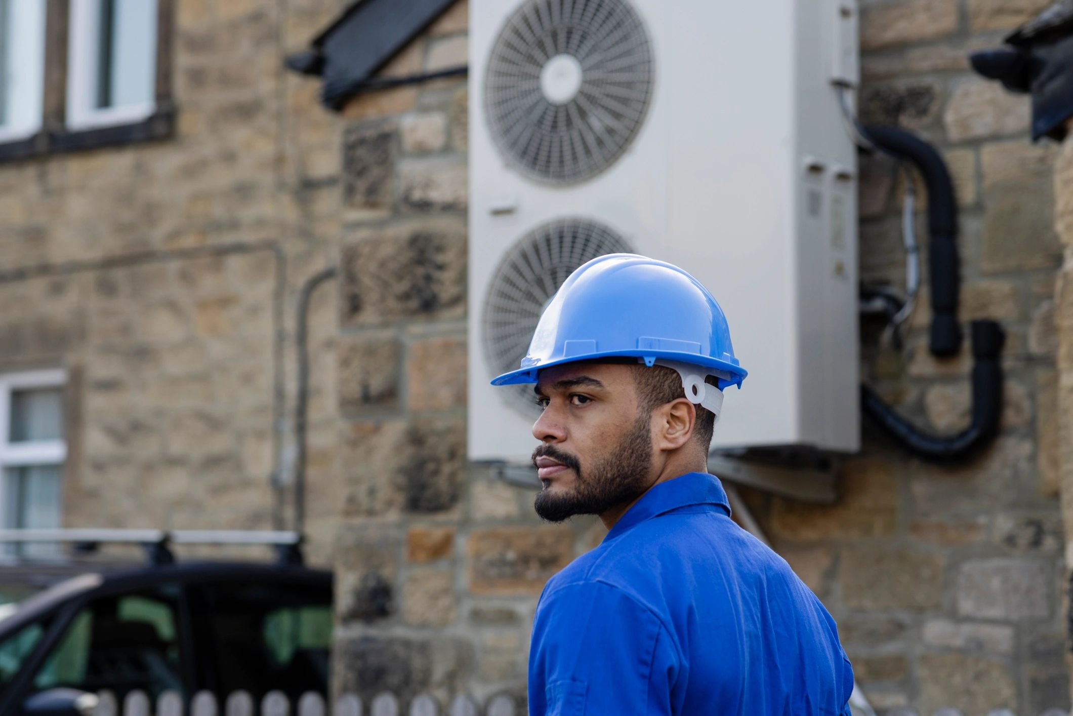 Technician working near a home mechanical system